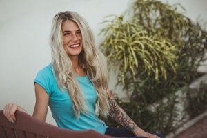 smiling blonde woman in aftercare program