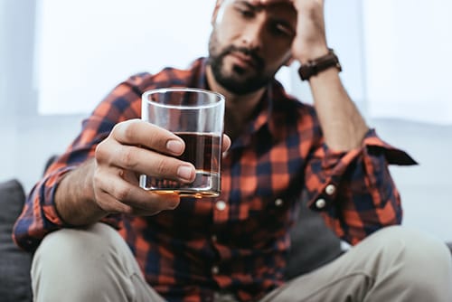 signs of alcoholism man showing symptoms of alcoholism