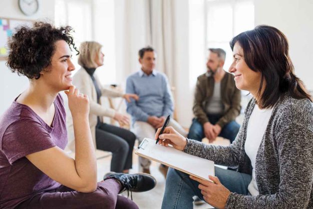 therapy group meets at alcohol detox center