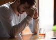 guy sitting at a bar who is a functioning alcoholic
